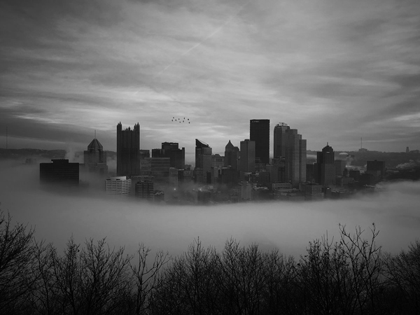 black and white photography city fog